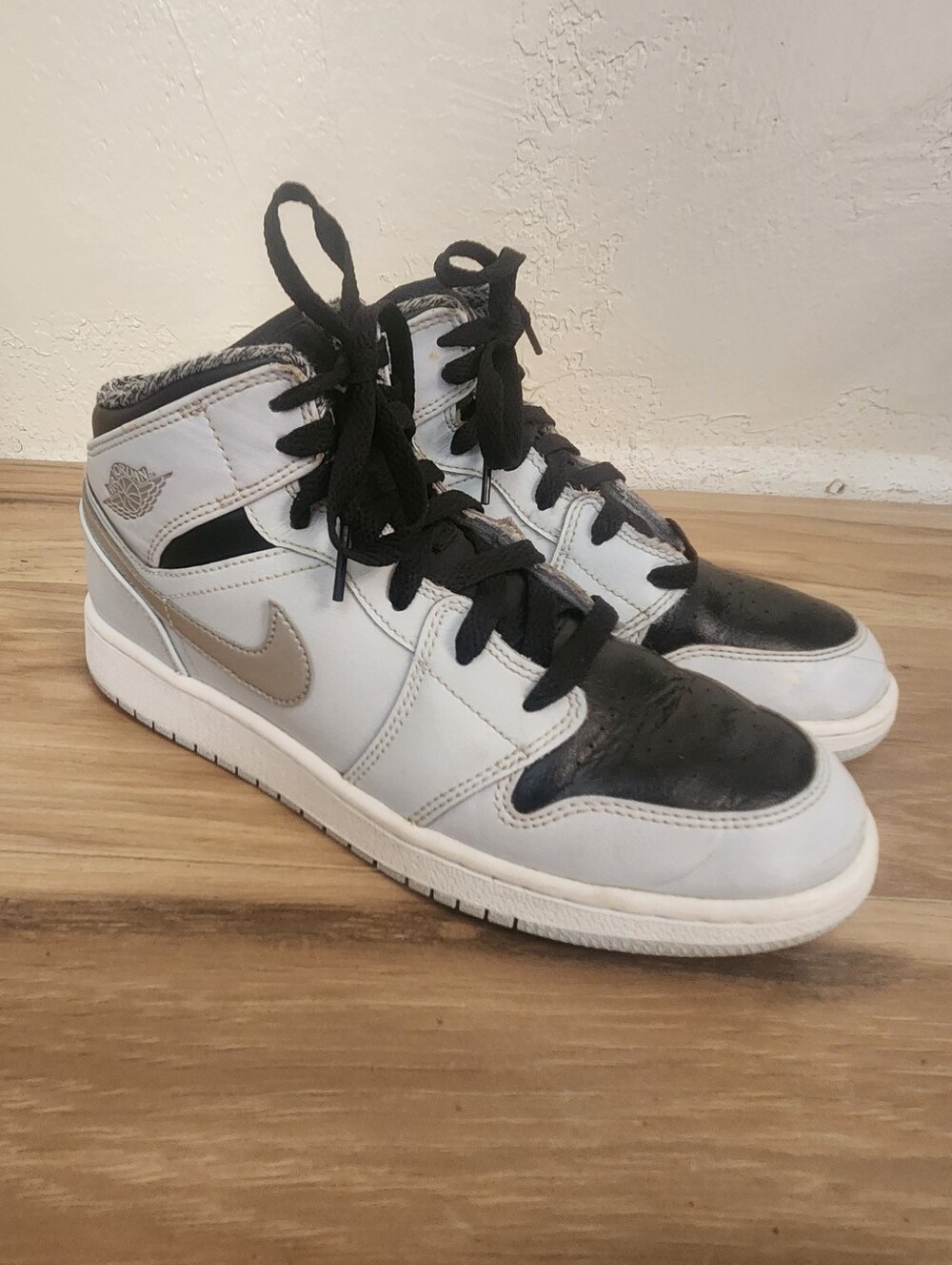 Nike Air Jordan 1 Mid Sneakers in White, Black & Silver